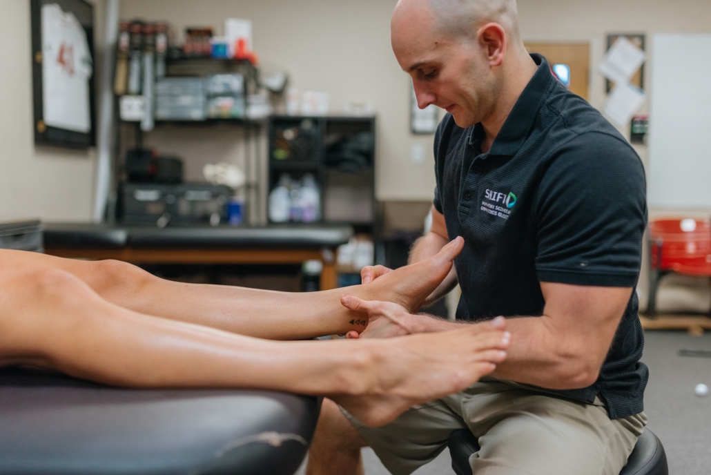 Dr. Dave Tilley performing ankle manual therapy